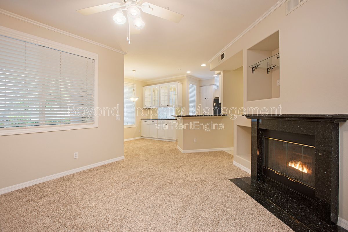 ***2 BED 2 BATH CONDO***PET-FRIENDLY***DETACHED GARAGE***FIREPLACE***GROUND FLOOR UNIT*** property image