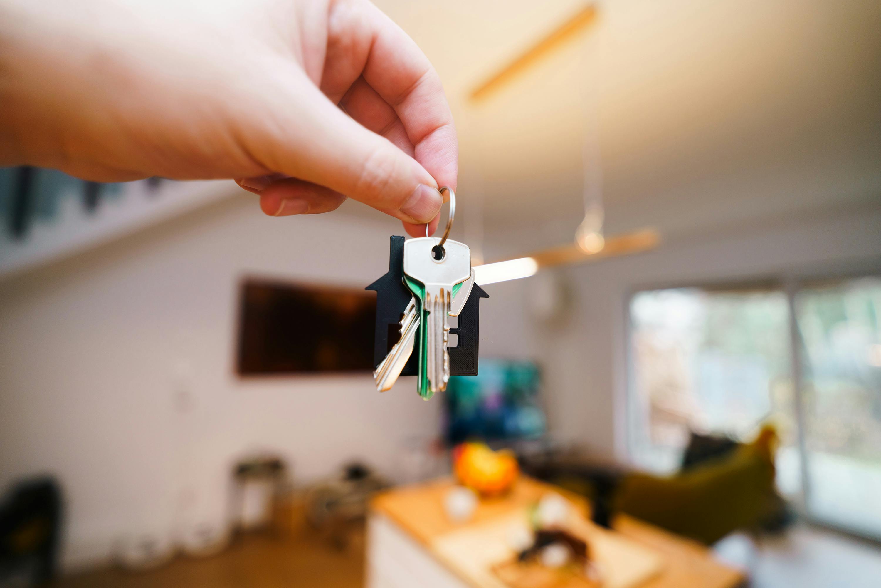 someone holding up house keys