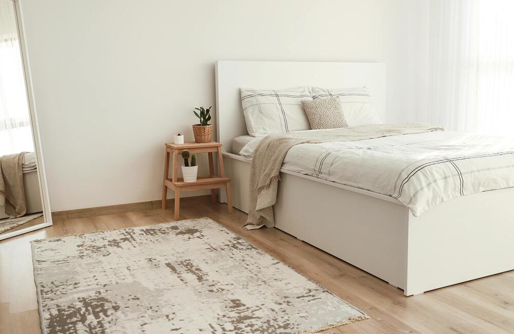 a white and light brown bedroom