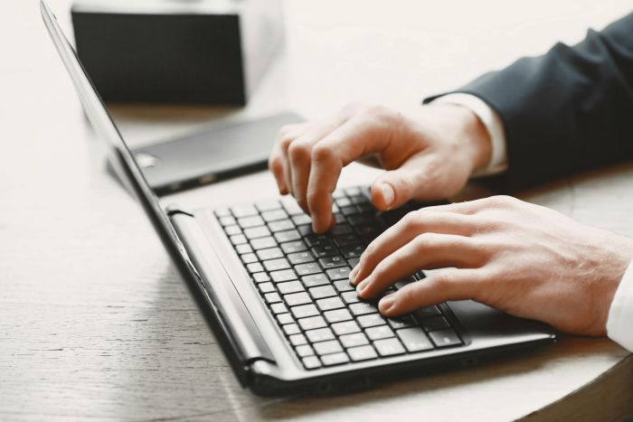 Person in Suit Using an Online Portal