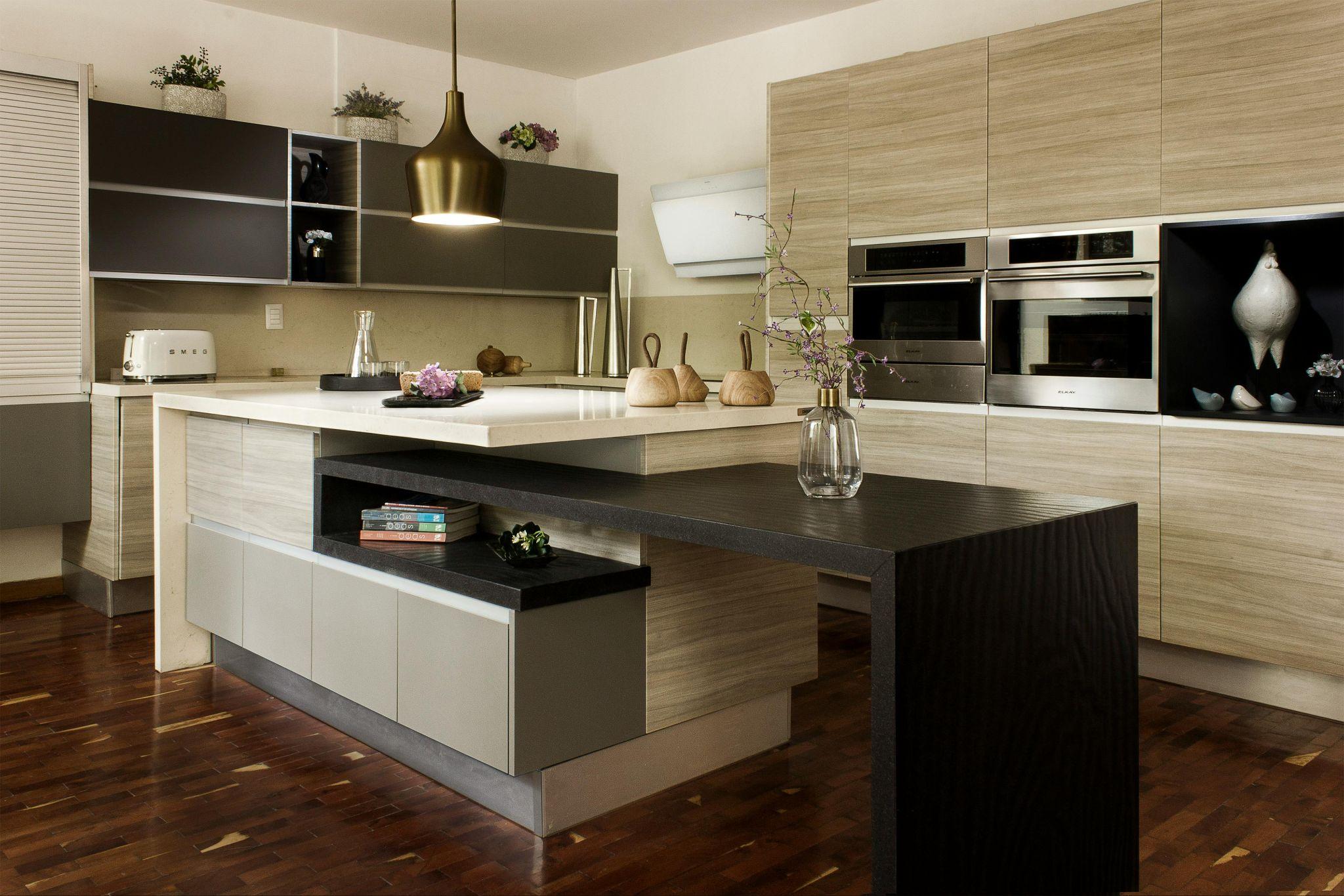 A sleek, modern kitchen with dark, neutral accents